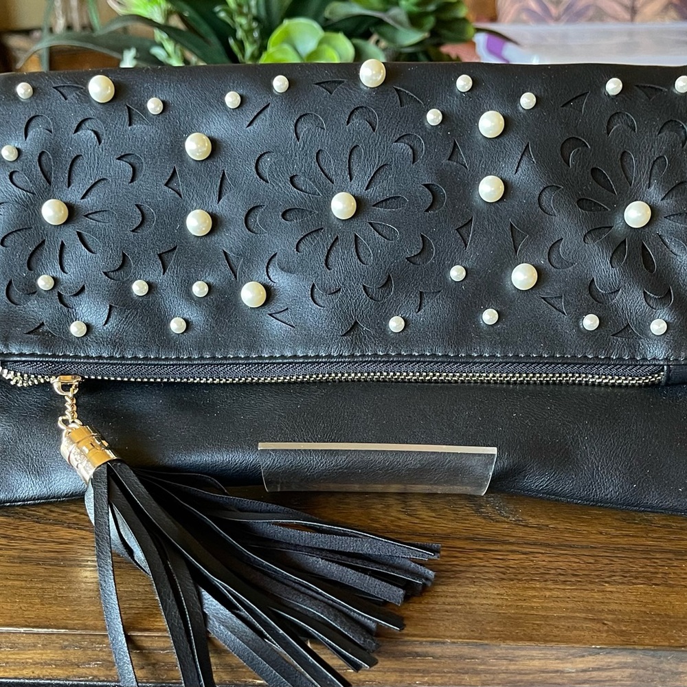 Black clutch with pearls.